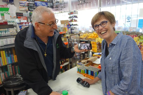 A shop keeper playfully demonstrated his monitors